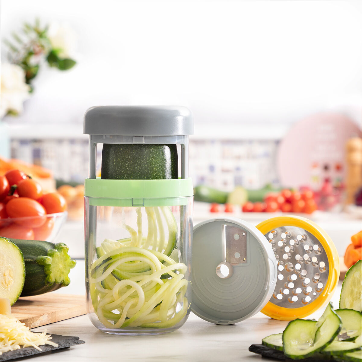 Vegetable spiralizer with sliced zucchini on a kitchen counter